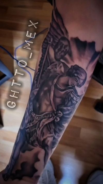Black and grey archangel with spread wings and a raised sword running down a forearm