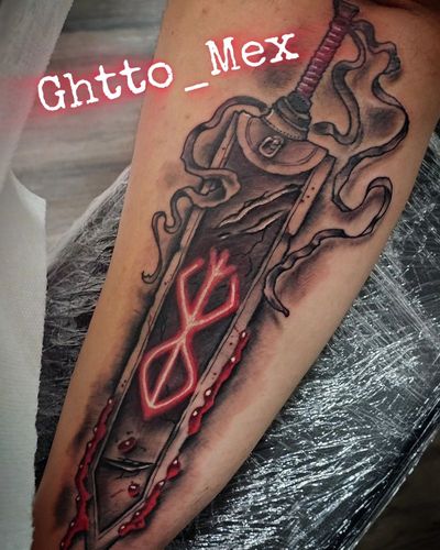 Large cloth wrapped greatsword with a glowing red brand symbol and red blood detail on a forearm