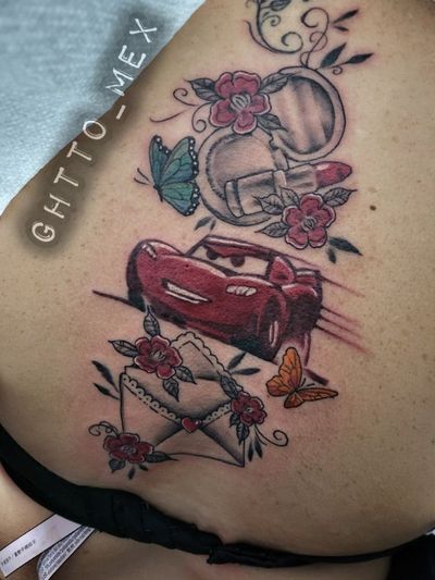 Red cartoon race car with a compact mirror, sealed love letter, red flowers and two butterflies on a back